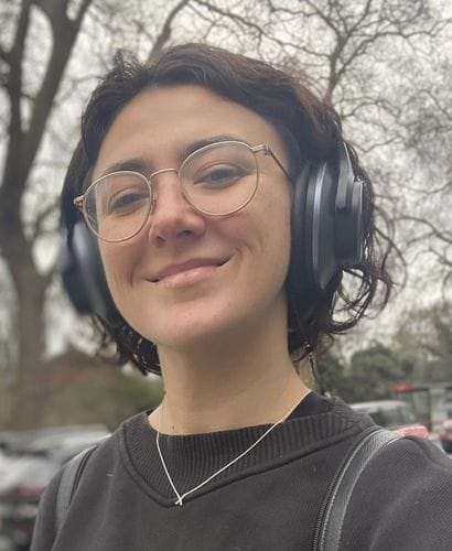 Customer wearing black Oneodio headphones outdoors