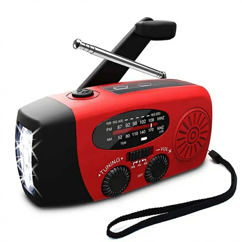 Red emergency radio with its folding crank, solar panel and telescopic antenna visible