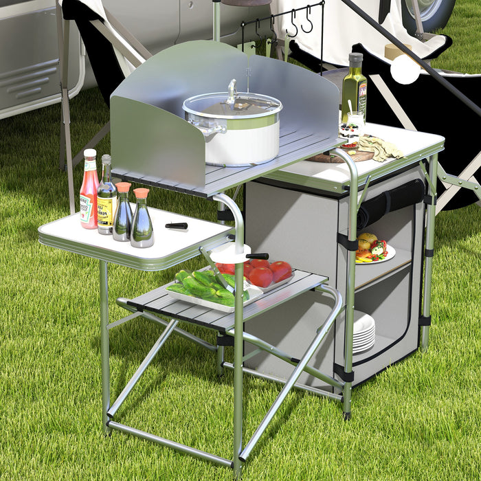 Folding Camping Kitchen Station with Storage - Aluminum Picnic Table with Windshield & Light Stand - Portable BBQ Setup with Carry Bag for Outdoor Enthusiasts